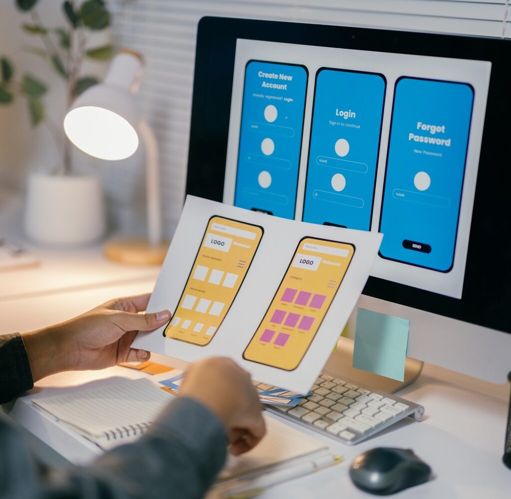Ux Designer Is Reviewing Paper Prototypes Of A Mob NLR769M 1024x1000
